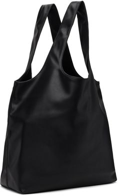 Grained faux-leather tote in black. Logo printed at face. · Twin shoulder straps · Patch pocket at interior · Full cotton twill lining · H14.25 x W19.75 x D6.25 · Total height: 23.5 Supplier color: Black Black Coated Canvas Shoulder Bag For Shopping, Chic Black Coated Canvas Shoulder Bag, Black Coated Canvas Bags For Work, Black Coated Canvas Shoulder Bag For Work, Chic Leather-backed Shoulder Bag For Shopping, Leather-backed Double Handle Shoulder Bag For Work, Chic Shoulder Bag With Leather Backing For Shopping, Double Handle Leather Backing Shoulder Bag For Work, Chic Leather-backed Business Shoulder Bag