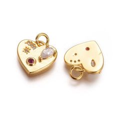 1 - Gold Heart with Gems Charm * Gold plated brass * Red and clear gems * Jewelry Making Supplies * Cubic Zirconia pendant * Size: about 12.5mm wide, 12.5mm long, 3mm thick, hole: 3mm. * Color: Gold * Quantity: 1 ❤ Create Something Lovely! Heart Charms For Jewelry Making On Valentine's Day, Dangling Charms Jewelry For Valentine's Anniversary, Valentine's Day Anniversary Jewelry With Dangling Charms, Heart Charms For Jewelry Making Valentine's Day, Heart Pendant Charms For Jewelry Making, Valentine's Day Heart Pendant Charms For Jewelry Making, Valentine's Day Jewelry Pendant With Dangling Charms, Heart Shaped Cubic Zirconia Charms Jewelry, Valentine's Day Cubic Zirconia Charms Jewelry