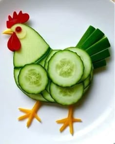 a chicken made out of cucumbers on a plate