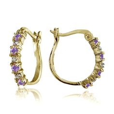 These beautiful hoop earrings for women feature 2.5mm round simulated amethyst stones. The earrings are crafted of yellow gold flashed sterling silver and are nickel free. The earrings secure by post with snap-down backs. Product Details Metal Type yellow-gold-flashed-silver Metal Stamp 925-sterling Weight 3GR Length 18MM Width 3MM Back Finding post-with-snap-down Stone Details Gem Type amethyst Number of Stones 8 Stone Shape round-shape Total Weight 0.4 Setting Type prongs Stone Creation Method Long Gold Earrings, Jeweled Earrings, Blue Topaz Stone, Pink Topaz, Gold Necklace Layered, Stunning Earrings, London Blue Topaz, Earrings Collection, Amethyst Stone