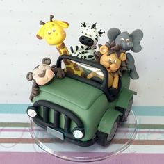 there is a cake that has animals in the car