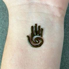 a small hand with a spiral design on it