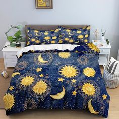 a bed room with a neatly made bed covered in blue and yellow sunflowers