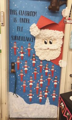 this classroom door is decorated with santa claus