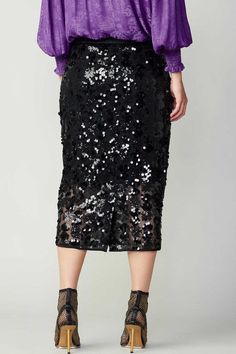 Mid-waisted, black sequin pencil midi skirt. Pair with our long sleeve surplus sequin top (Style #2330293) for the complete evening look! 100% Polyester Black Pencil Skirt For Fall Party, Winter Party Midi Length Skirt, Evening Fall Pencil Skirt, Winter Party Pencil Skirt, Chic Sequined Pencil Skirt For Night Out, Chic Evening Pencil Skirt For Fall, Chic Fall Evening Pencil Skirt, Fitted Sequin Pencil Skirt For Night Out, Fitted Sequin Pencil Skirt