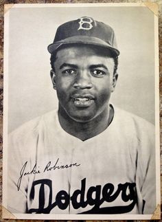 an old black and white photo of a baseball player with the name dodger on it