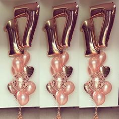 balloons are arranged in the shape of numbers with tassels attached to each balloon