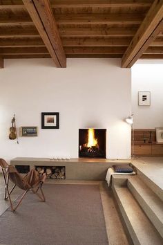 a living room filled with furniture and a fire place