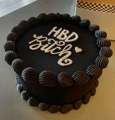 a black cake sitting on top of a table