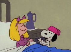 a cartoon character laying in bed next to a dog with a pink hat on it's head