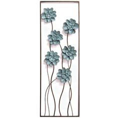 a metal wall sculpture with blue flowers on it