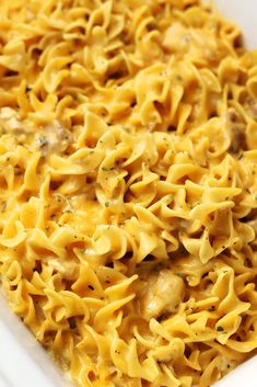 a casserole dish with chicken and noodles in it, ready to be eaten