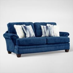 a blue couch with two pillows on it