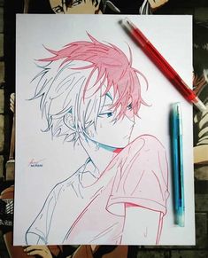 a drawing of an anime character with red hair and blue eyes next to a pen