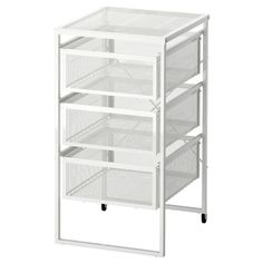 a white shelf with drawers on wheels