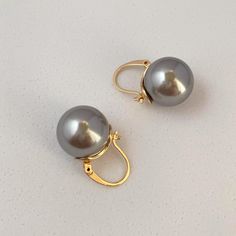 These Pearl Earrings Are the Perfect Fashion Accessory for Any Women! Fashion And Trends Come and Go, But True Elegance Stays Unchanged, These Elegant Earring Designs Have Stood the Test of Time, and are a True Timeless Classic that You'll Be Able to Enjoy Wearing for Years and Years to Come! Perfectly Suit of a Wedding, Appointment, Christmas, Party or Casual Wearing. Material: Brass Earrings Size: 1.0"x0.6" Elegant Nickel-free Gray Jewelry, Elegant Gray Earrings As Gift, Elegant Gray Earrings For Gift, Elegant Gray Earrings With Ear Wire, Gray Drop Earrings For Pierced Ears, Elegant Gray Metal Earrings, Gray Dangle Earrings For Pierced Ears, Gray Drop Earrings, White Pearl Earrings