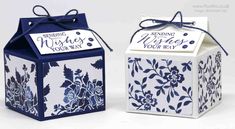 two blue and white boxes with tags tied to the top, one is for wedding wishes