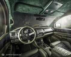 the interior of a car is shown in this artistic photo with green and black accents