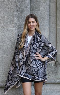 Made from silk, this lightweight scarf is a statement accessory for all occasion styling. Sprayed with a delicate paisley design, this elegant scarf can artfully draped around the shoulders or used as a lightweight shawl in the summer evenings. Care: Hand wash in cold water or dry clean only. Material: 100% Silk Size: 180 cm * 90 cm Elegant Pashmina Shawl With Paisley Print, Bohemian Silk Scarf With Paisley Print, Black Summer Shawl Scarf, Elegant Silk Scarves With Paisley Print, Black Shawl Scarf For Summer, Elegant Pashmina Scarf With Paisley Print, Elegant Pashmina Scarves With Paisley Print, Patterned Silk Scarf Shawl, Patterned Silk Shawl Scarf