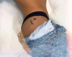 a woman with a small tattoo on her lower leg and the bottom half of her stomach