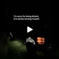 a car is parked in the dark with its lights on and it's saying i'm sorry for being distant