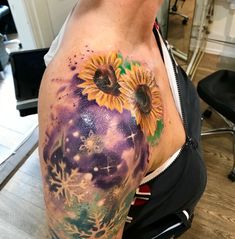 a man with a sunflower tattoo on his arm