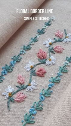 the floral border line is made with simple stitchs and flowers on linen, which are hand - sewn