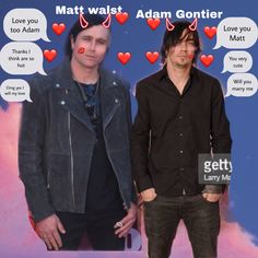 two men standing next to each other in front of a poster with hearts on it