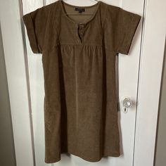 Apc Brown Stretch Fine Wale Corduroy Smock Dress. Size Small. Has A Soft Velvet-Y Feel. Short Cuffed Sleeves. Three Buttons At Center Front. Dress Has Pockets! Looks Really Cute With A Skinny Sweater Or Long Sleeve Shirt Underneath And Some Tights. Also Great On Its Own With Some Sneakers. Very Versatile And Comfortable. Bought At The Apc Store In Nyc In Early 2000s. Sold As-Is. Smock Dress, Early 2000s, Cuff Sleeves, Soft Velvet, A P, Long Sleeve Shirt, Smocking, Sleeve Shirt, Long Sleeve Shirts