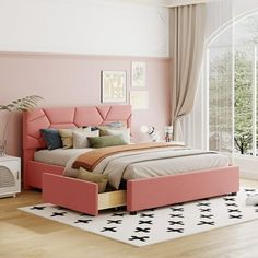 a bedroom with pink walls and furniture in the corner, along with a white rug on the floor