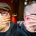 two men wearing face coverings and glasses