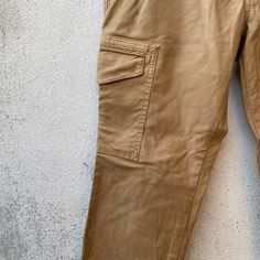 "PLEASE READ DESCRIPTION BELOW BEFORE BUYING👇🏻 *ITEM:Designworks cargo pants *ITEM DETAILS: 👇🏻 Please be aware that all vintage items will usually show a few signs of wear or fading due to age, but anything visible such as stains or holes, and serious flaws have been photographed.For any further information on this item please contact us and we will be happy to help SIZE:50 ON TAG manual size 34\" *ACTUAL SIZE MEASUREMENT: 👇🏻 WAIST: 34\"INCHES LENGTH (OUTSEAM) : 37\"INCHES (INSEAM) : 27\"I Beige Utility Pants With Patch Pockets, Khaki Work Pants With Pockets For Workwear, Khaki Work Pants With Pockets, Khaki Cotton Cargo Pants With Flap Pockets, Khaki Full-length Cargo Jeans With Flap Pockets, Khaki Work Pants With Cargo Pockets, Khaki Cargo Jeans With Hip Pockets And Tapered Leg, Khaki Tapered Leg Cargo Jeans With Hip Pockets, Khaki Pants With Patch Pockets For Work