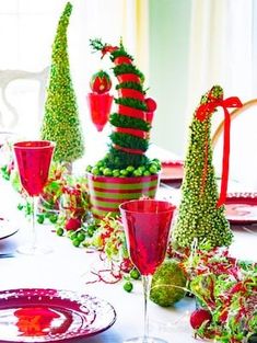 the table is decorated with red and green decorations