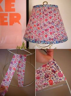 the lamp shade is made from fabric and has pink flowers on it, as well as blue