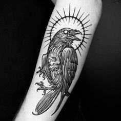 a black and white photo of a tattoo with an eagle on it's arm