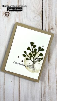 a card with a plant on it that says i'm thinking of you