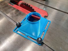 a blue and red tool holder on a metal surface