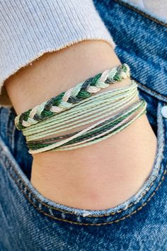 A woman’s wrist with her hand in her jeans’ pocket. She’s wearing a set of three green macrame bracelets. Wax Bracelets, Waxed Cord Bracelets, Green Friendship Bracelet, Cool Friendship Bracelets, Wax Cord Bracelet, Cotton Bracelet, Beach Bracelet, Surfer Bracelets, Gifts For Surfers