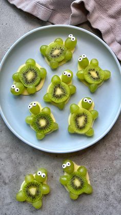 kiwi slices with googly eyes on a plate