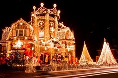 a large house covered in christmas lights and decorations