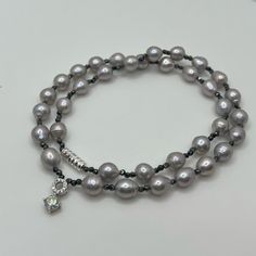 Handmade Necklace/Double Bracelet: Made With Light Gray Freshwater Natural Pearls, Organic Hematite Gemstone Beads, White Gold Over S925 0.5 Carat Moissanite Diamond Pendant, Luxurious 18k White Gold Over S925 (Solid Sterling Silver) Screw Clasp! Pearls Size Approx 6.6mm, Hematite Beads 1.8mm! Fixed Length 16”. Please Note, This Necklace Made With Natural Pearls! Natural Pearls Are Products Of Nature And Can Have Birthmarks Or Minor Variationsif You Mind Don’t Buy!! Can Be Used As Necklace Or As Silver Single Strand Pearl Bracelet, Silver Single Strand Beaded Bracelets As Gift, Silver Single Strand Beaded Bracelet Gift, Silver Single Strand Beaded Bracelet, Luxury Silver Beaded Bracelets With Gemstone, Luxury Hand-strung Silver Jewelry, Silver Double Strand Hand-strung Beaded Bracelets, Elegant Silver Beaded Gemstone Bracelets, Silver Double Strand Hand-strung Necklace