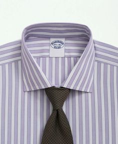 Meet our most luxurious dress shirts: fabrics woven in Italy by Thomas Mason®, the world-renowned English company crafting fine textiles with unwavering quality since 1796. Ultra-fine 120s count, 2-ply thread offers lightweight versatility with a soft, smooth handfeel. Highly considered details like pucker-free seams, and our signature 6-Pleat Shirring® at the cuffs round out the ideal dress shirt..Available in Fits:.REGULAR Our average fit across the chest, body and sleeves..English Spread Coll Classic Purple Cotton Dress Shirt, Elegant Purple Shirt For Business Casual, Classic Purple Dress Shirt For Work, Purple Cotton Formal Dress Shirt, Classic Purple Dress Shirt For Formal Occasions, Elegant Purple Dress Shirt For Business, Elegant Purple Business Shirt, English Collar, Luxurious Dress