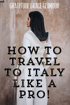 a woman standing in front of a wall with the words how to travel to italy like a pro