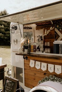 the food truck is decorated with garlands and bunting