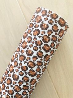 an animal print umbrella on a wooden floor