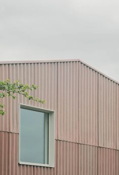 the building is made of metal and has a large window