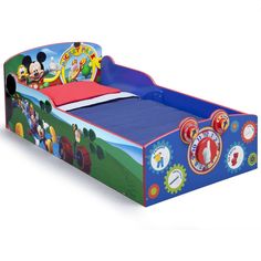 a bed with mickey mouse and friends on it