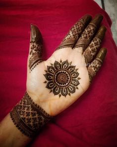 henna tattoo on the palm of someone's hand