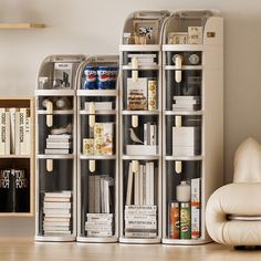 a living room filled with lots of books and furniture