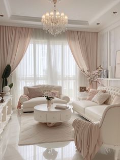 a living room filled with white furniture and a chandelier hanging from the ceiling